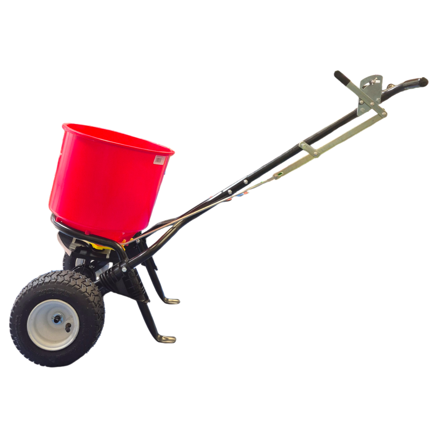 EarthWay 2600A heavy-duty broadcast spreader showing 22cm high-flotation pneumatic tyres for smooth operation on uneven terrain