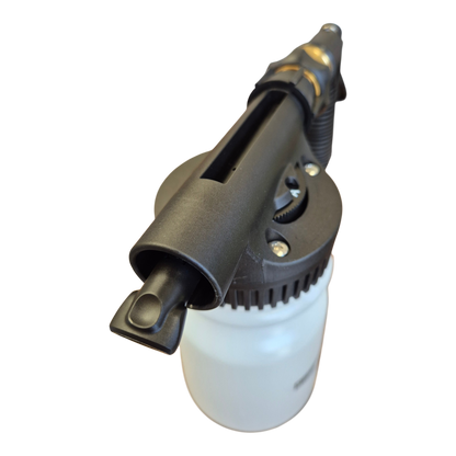 Mighty Goat Lawns hose-on sprayer applying wetting agent or soil conditioner in garden