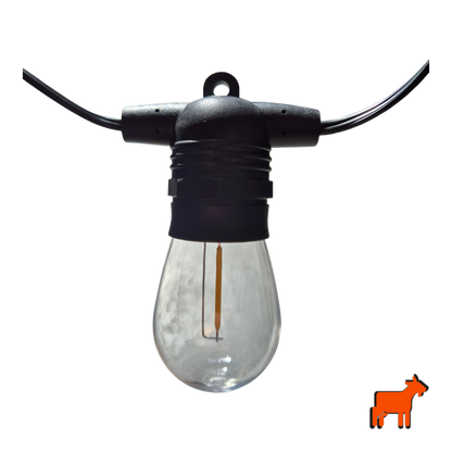Solar garden festoon lights installed across outdoor patio and pergola during daytime