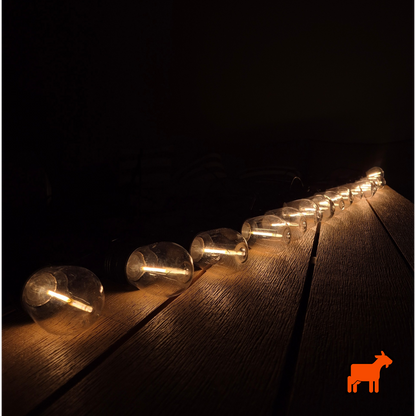 Solar garden festoon lights by Mighty Goat Lawns showing outdoor waterproof string lighting setup
